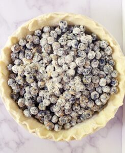 making blueberry pie