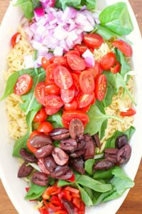 Making orzo pasta salad